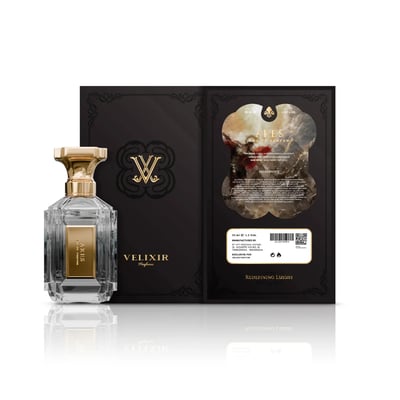 Velixir Ares 100ml EDP — A clear glass perfume bottle with a gold cap and a gold label, standing next to its black and gold packaging with ornate details and ingredient information. | Velixir Ares 100ml EDP — Botol minyak wangi kaca jernih dengan penutup emas dan label emas, berdiri di sebelah pembungkus hitam dan