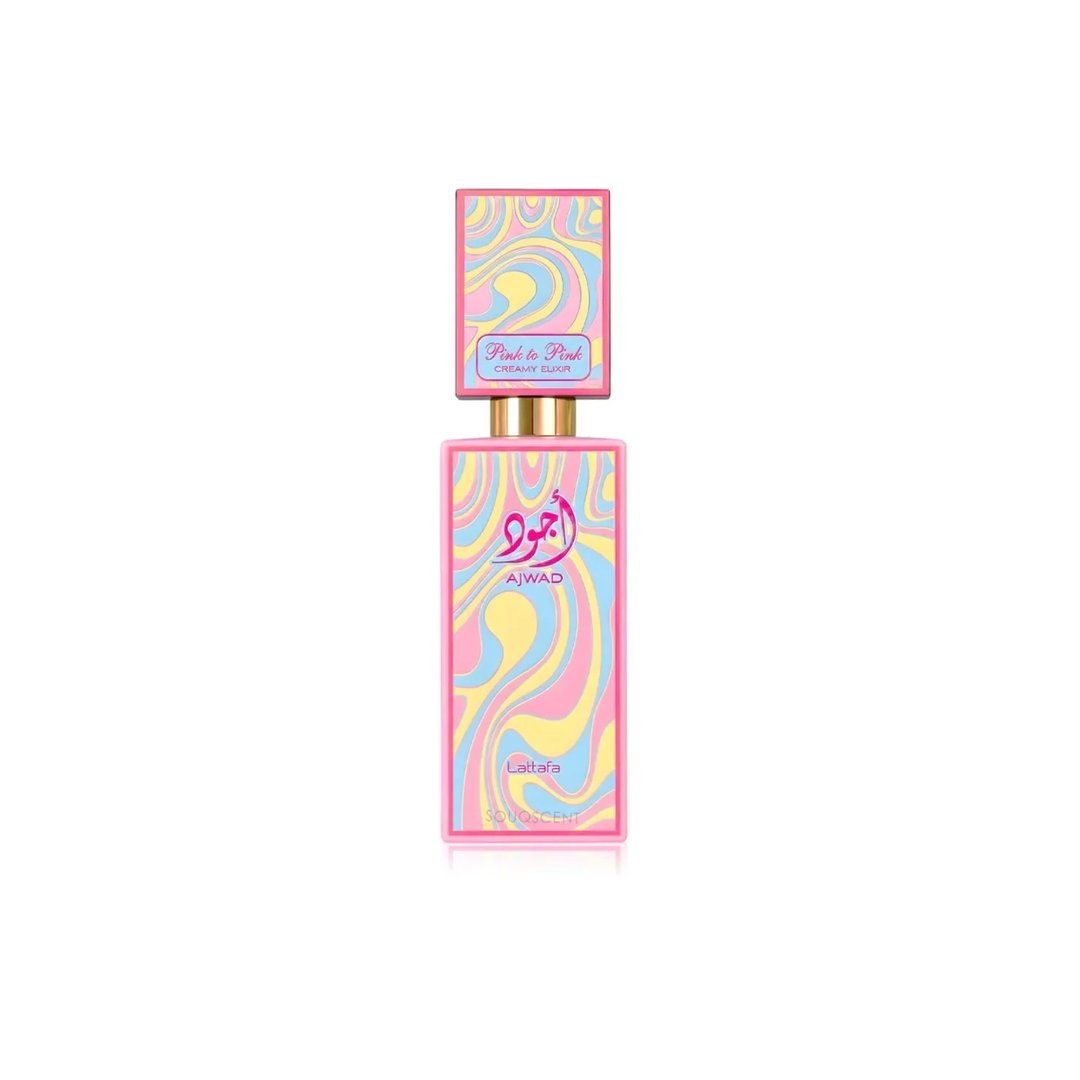 Lattafa Ajwad Pink 2 Pink Creamy Elixir — Botol minyak wangi tinggi berbentuk segi empat dengan corak pusaran berwarna merah jambu, kuning dan biru. Penutupnya juga dihiasi corak yang sama. Aksen emas kelihatan pada leher botol.