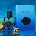 French Avenue Aromatix Magnetiq 100ml — Blue glass perfume bottle with black geometric cap, next to a blue gradient box. Lime, lavender, cardamom, and a white flower are arranged around the bottle.