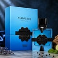 French Avenue Aromatix Magnetiq 100ml — Blue perfume bottle and box with black geometric cap and emblem, set against a dark blue textured background with lavender and lime accents.
