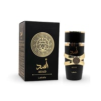 Lattafa Asad Lattafa EDP 100ml Men — Black perfume box with gold lion emblem and bottle with gold criss-cross accents on white background.