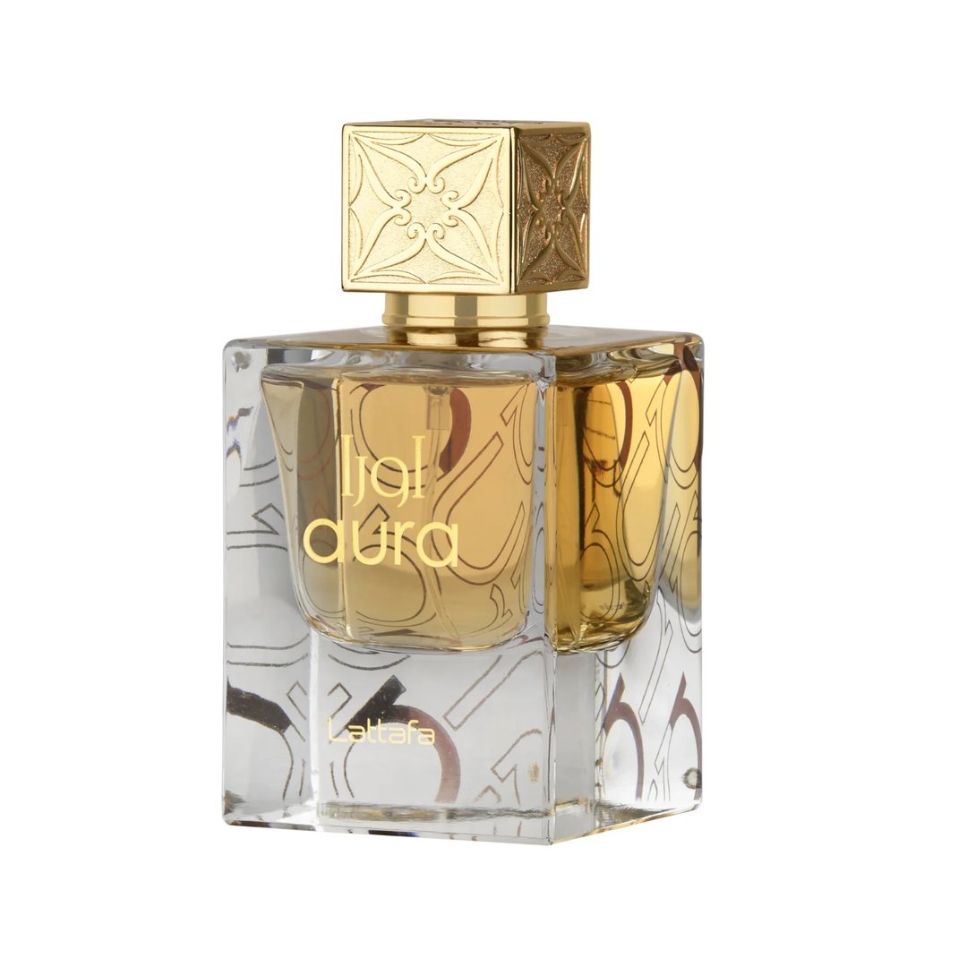 Lattafa Aura by Lattafa 60ml EDP — A clear glass perfume bottle with gold liquid and ornate gold cap, featuring Arabic calligraphy design on the bottle | Lattafa Aura by Lattafa 60ml EDP — Botol minyak wangi kaca jernih dengan cecair emas dan penutup emas berhias, menampilkan reka bentuk kaligrafi Arab pada botol