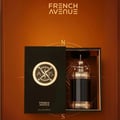 French Avenue Axis by French Avenue 100ml — Black box open to reveal a dark glass bottle with a metallic top, featuring a compass design on the box flap. | French Avenue Axis by French Avenue 100ml — Kotak hitam terbuka mendedahkan botol kaca gelap dengan bahagian atas logam, menampilkan reka bentuk kompas pada