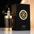 French Avenue Axis by French Avenue 100ml — A luxurious black box with a gold compass logo stands next to a dark glass perfume bottle with an ornate gold atomizer and base. | French Avenue Axis by French Avenue 100ml — Kotak hitam mewah dengan logo kompas emas berdiri di sebelah botol minyak wangi kaca gelap dengan