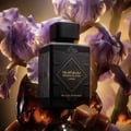 Lattafa Bade'e Al Oud Black Exposed Lattafa — Black matte perfume bottle with ornate diamond-shaped label featuring gold Arabic script and "BADEE AL OUD" in English, set against a light wood grain background.