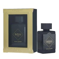 Lattafa Bade'e Al Oud Black Exposed Lattafa 100ml — Black perfume bottle and its gold-accented box, displayed side-by-side against a white background.