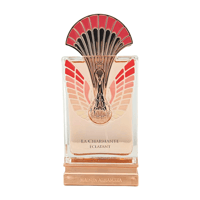 Maison Alhambra La Charmante Eclatant — Clear glass perfume bottle with rose gold base, featuring a decorative peacock-like gold and red fan-shaped cap and wing motifs on the bottle.