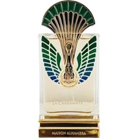 Maison Alhambra La Charmante by Maison Alhambra 100ml EDP — Clear glass perfume bottle with gold base and ornate gold and green peacock feather-inspired cap and detailing on the front.