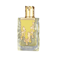 Maison Alhambra Sugar Me Creme Brulee — Clear glass perfume bottle with a gold cap and a yellow, dripping caramel-like design on the front, showing the liquid inside.