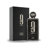 Afnan 9 PM Night Out Extrait de Parfum — A black textured box and a matching textured perfume bottle with a round cap are displayed against a white background. | Afnan 9 PM Night Out Extrait de Parfum — Sekotak kotak bertekstur hitam dan sebotol minyak wangi bertekstur yang sepadan dengan penutup bulat dipaparkan