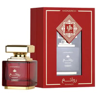 Al Wataniah Rawaee Monarch Eau De Parfum 100ml — A red glass perfume bottle with a gold cap sits next to its red and gold presentation box, which has a window showing the bottle inside. | Al Wataniah Rawaee Monarch Eau De Parfum 100ml — Sebotol minyak wangi kaca merah bertudung emas terletak di sebelah kotak