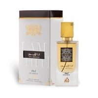 Lattafa Ana Abiyedh Leather 60ml by Lattafa Perfumes — Botol kaca jernih berisi cecair keemasan, lengkap dengan penutup emas berkilau, diletakkan di sebelah kotak putih bertekstur dengan rekaan emas mewah