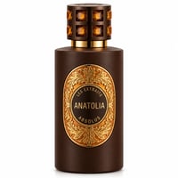 French Avenue Anatolia Absolus Les Extraits Unisex — Botol minyak wangi coklat gelap dengan label emas berukir dan penutup bertatah permata.