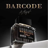 Paris Corner Autograph 100ml — A clear glass perfume bottle with a black cap and a black label featuring a barcode and gold text "BARCODE Autograph" against a dark gradient background. | Paris Corner Autograph 100ml — Botol minyak wangi kaca jernih dengan penutup hitam dan label hitam menampilkan kod bar dan teks emas