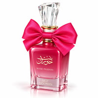 Ard Al Zaafaran Bint Hooran Rose Passion — Pink perfume bottle with a large fuchsia bow tied around the neck, gold accents, and a crystal-like cap.