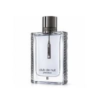 Armaf Club de Nuit Precieux II — Clear glass perfume bottle with metallic Greek key pattern on sides, dark grey cap, and a hanging metal tag with 'ARMAAF' and a crystal.