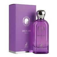 Maison Alhambra Delilah Viola 100ml — A purple glass perfume bottle with a silver cap stands next to its matching purple box, both featuring a silver crest and deer logo. | Maison Alhambra Delilah Viola 100ml — Botol kaca ungu dengan penutup perak berdiri di sebelah kotak ungu yang sepadan, kedua-duanya menampilkan