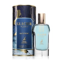 Maison Alhambra Glacier Flora 100ml — Botol kaca biru muda dengan penutup emas, bersebelahan dengan kotak silinder biru gelap bermotif bunga emas