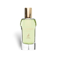 Maison Alhambra Glacier Heaven 100ml — A clear glass perfume bottle with light green liquid and a gold cap, featuring gold text and a deer logo on the label. | Maison Alhambra Glacier Heaven 100ml — Botol kaca jernih dengan cecair hijau muda dan penutup emas, menampilkan teks emas dan logo rusa pada label.