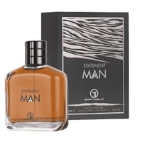 Grandeur Statement Man Eau De Parfum 100ml — A clear glass bottle of amber-colored perfume with a black and silver cap sits in front of its matching black and silver patterned box. | Grandeur Statement Man Eau De Parfum 100ml — Botol kaca jernih berisi minyak wangi berwarna perang duduk di hadapan kotak bercorak hitam