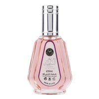 Ard Al Zaafaran Hareem Al Sultan EDP 50ml — Pink glass perfume bottle with a silver cap and a decorative label featuring Arabic script and "Hareem Al Sultan" text. | Ard Al Zaafaran Hareem Al Sultan EDP 50ml — Botol minyak wangi kaca merah jambu dengan penutup perak dan label hiasan yang menampilkan tulisan Arab dan