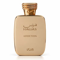 RASASI Hawas Addiction by Rasasi 100ml EDP — Botol minyak wangi emas dengan penutup emas berjalin, tertulis 'HAWAS ADDICTION' dalam Bahasa Arab dan Inggeris di hadapan.
