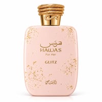 RASASI Hawas Glitz by Rasasi 100ml EDP — A light pink perfume bottle with gold flecks and a textured gold cap with diamond accents.