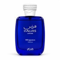 RASASI Hawas Sapphire FB Fragrances Edition by Rasasi — Botol minyak wangi kaca biru dengan penutup bertekstur putih, tulisan putih.