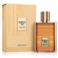 Khadlaj Karus Amber Gold — Amber and gold striped perfume bottle with matching box, featuring ribbed gold cap.