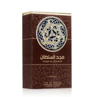 Asdaaf Majd Al Sultan 100ml EDP — Brown textured box with a circular Arabic knot design and Arabic text | Asdaaf Majd Al Sultan 100ml EDP — Kotak bertekstur coklat dengan reka bentuk simpul Arab bulat dan teks Arab