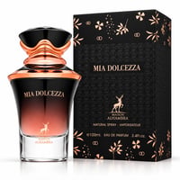Maison Alhambra Mia Dolcezza — Black and rose gold gradient perfume bottle with faceted black and rose gold cap, next to its matching black box with rose gold floral and geometric patterns. Deer logo visible on both.