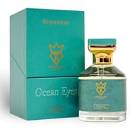 Bujairami Ocean Eyes by Bujairami 100ml Extrait — Teal box with gold logo next to a clear glass perfume bottle with a teal and gold label and cap, on a white background.