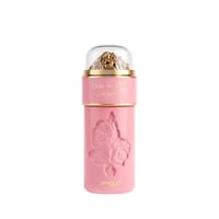 Zimaya Ode to Rose Royale Eau De Parfum 100ml by Zimaya — A pink perfume bottle with a clear dome top revealing gold-colored crushed material, featuring embossed roses on the body and gold text. | Zimaya Ode to Rose Royale Eau De Parfum 100ml by Zimaya — Botol minyak wangi merah jambu dengan tudung kubah jernih