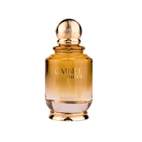 Khadlaj Ombre Notes by Khadlaj 100ml EDP Unisex — Amber-toned glass perfume bottle with a textured gold cap, featuring gold lettering 'OMBRE notes' and 'KHADLAJ' on the front, isolated on a white background.