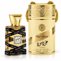 Lattafa Oud Mood 30ml EDP Unisex — Gold-capped perfume bottle with black ribbon wrap, next to a matching cylindrical gold and cream presentation box with ornate patterns and a gold chain handle.