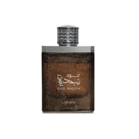 Lattafa Oud Najdia — Square brown glass perfume bottle with a textured finish, featuring Arabic script and 'OUD NAJDIA' text, topped with a silver cap encrusted with rhinestones. 'Lattafa' is printed at the bottom.