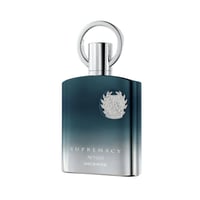 Afnan Supremacy Incense — A dark teal gradient perfume bottle with a silver ring cap and a silver emblem on the front.