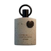 Afnan Supremacy Collector’s Edition — Speckled grey bottle with black cap and ring, featuring a bronze crest emblem and text.