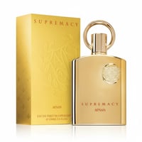 Afnan Supremacy Gold — Gold perfume bottle and matching box with embossed floral design on white background