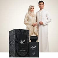 Al Wataniah Al Layl — A black perfume bottle and box sit before a couple in traditional attire.