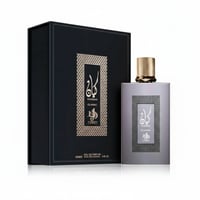 Al Wataniah Kayaan Classic — Black gift box and grey perfume bottle with gold cap, both featuring ornate gold patterned