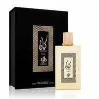 Al Wataniah Kayaan Gold — Black box with gold geometric pattern next to a gold-toned glass perfume bottle.