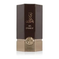 Al Wataniah Ain Emarat – Hexagonal brown and gold perfume box with Arabic calligraphy and embossed emblem.