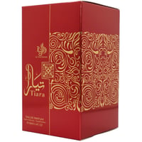 Al Wataniah Tiara — Red perfume box with gold ornate scrollwork and Arabic calligraphy.
