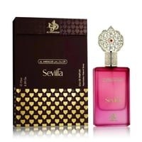 Al Wataniah Sevilla by Al Wataniah 75ml EDP Women — A pink gradient perfume bottle with a decorative gold cap sits next to