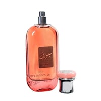 Ard Al Zaafaran Mousuf Wardi — Pink glass perfume bottle with brown label and silver cap with pink top, isolated on white.