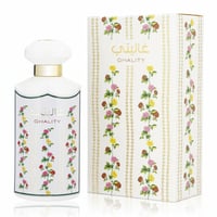 Ard Al Zaafaran Ghality — White perfume bottle with floral accents next to its matching floral patterned box.