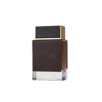 Ard Al Zaafaran Oudi — Brown leather-accented perfume bottle with gold cap and Arabic script