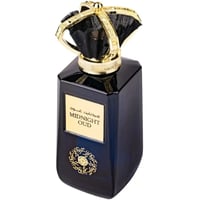 Ard Al Zaafaran Midnight Oud — Dark blue glass perfume bottle with a gold crown-like cap and gold label.
