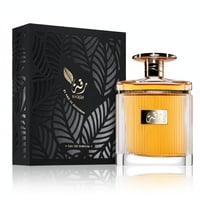 Ard Al Zaafaran Riqqa — Black patterned box and golden liquid perfume bottle with ribbed glass